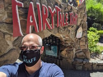 Fairy Tale Town employee wears Stay SAFE mask from SAFE Credit Union