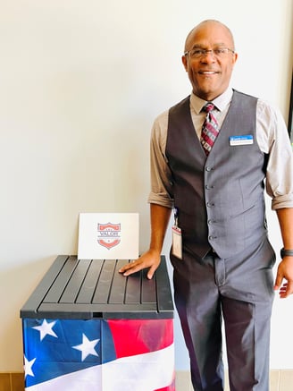 Web Developer Christopher Rhodes with flag collection box