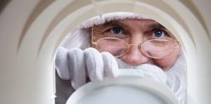 Santa looking into mailbox